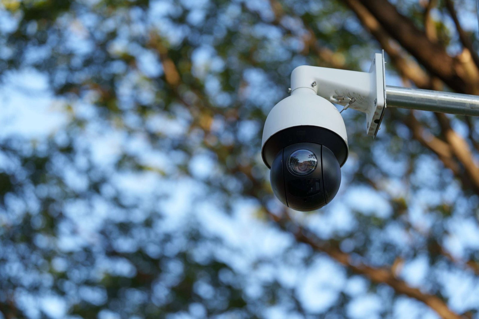 A pair of high-definition CCTV cameras mounted on the corner of a commercial building, providing comprehensive 24/7 surveillance camera coverage for the perimeter