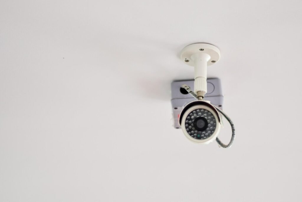A ceiling-mounted bullet security camera with an infrared LED array, representing the essential hardware factors to consider when evaluating CCTV System Costs in Pakistan for a reliable surveillance system and comprehensive video surveillance system using top brands like a Hikvision system, Dahua system, or Ezviz system.