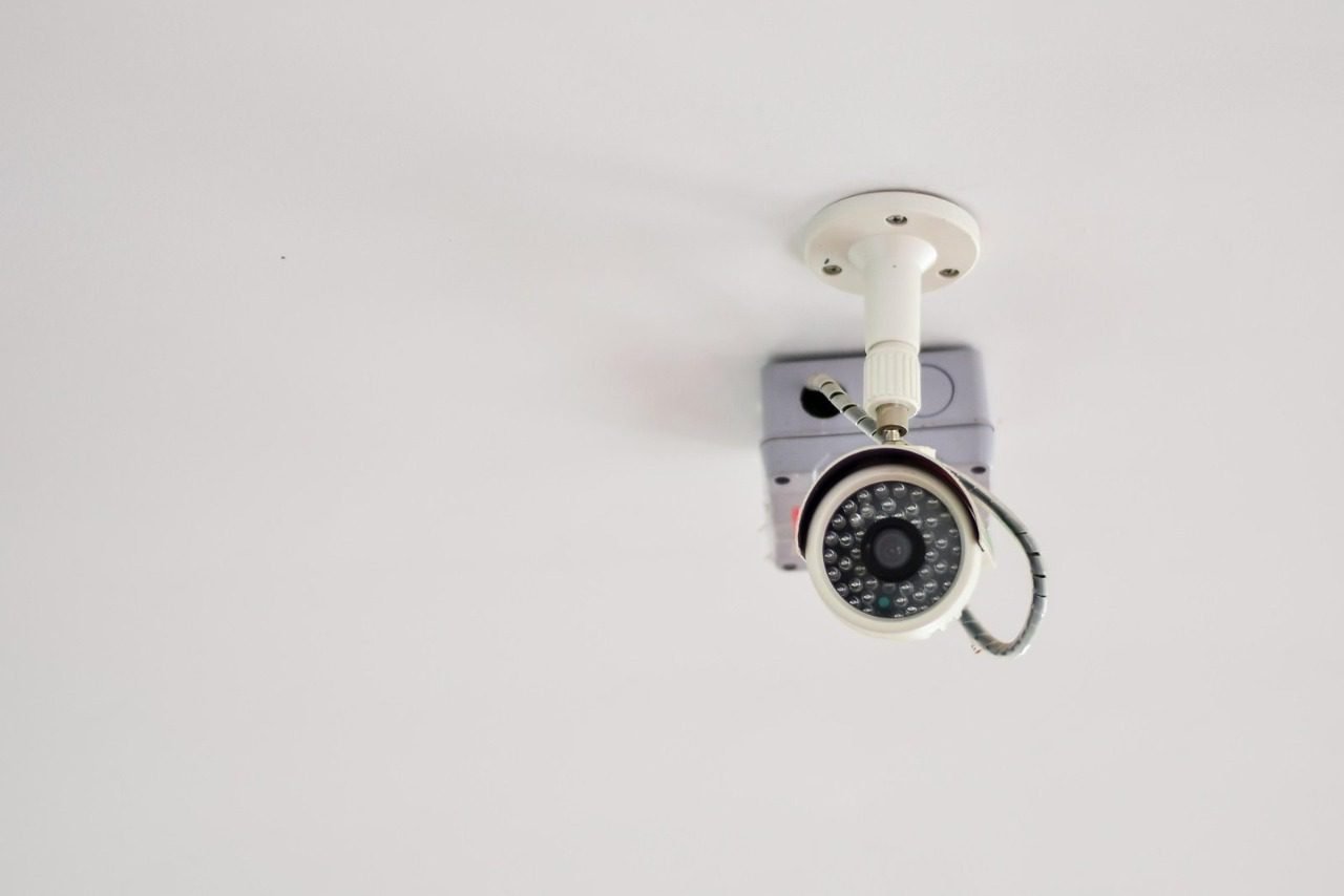 A ceiling-mounted bullet security camera with an infrared LED array, representing the essential hardware factors to consider when evaluating CCTV System Costs in Pakistan for a reliable surveillance system and comprehensive video surveillance system using top brands like a Hikvision system, Dahua system, or Ezviz system.